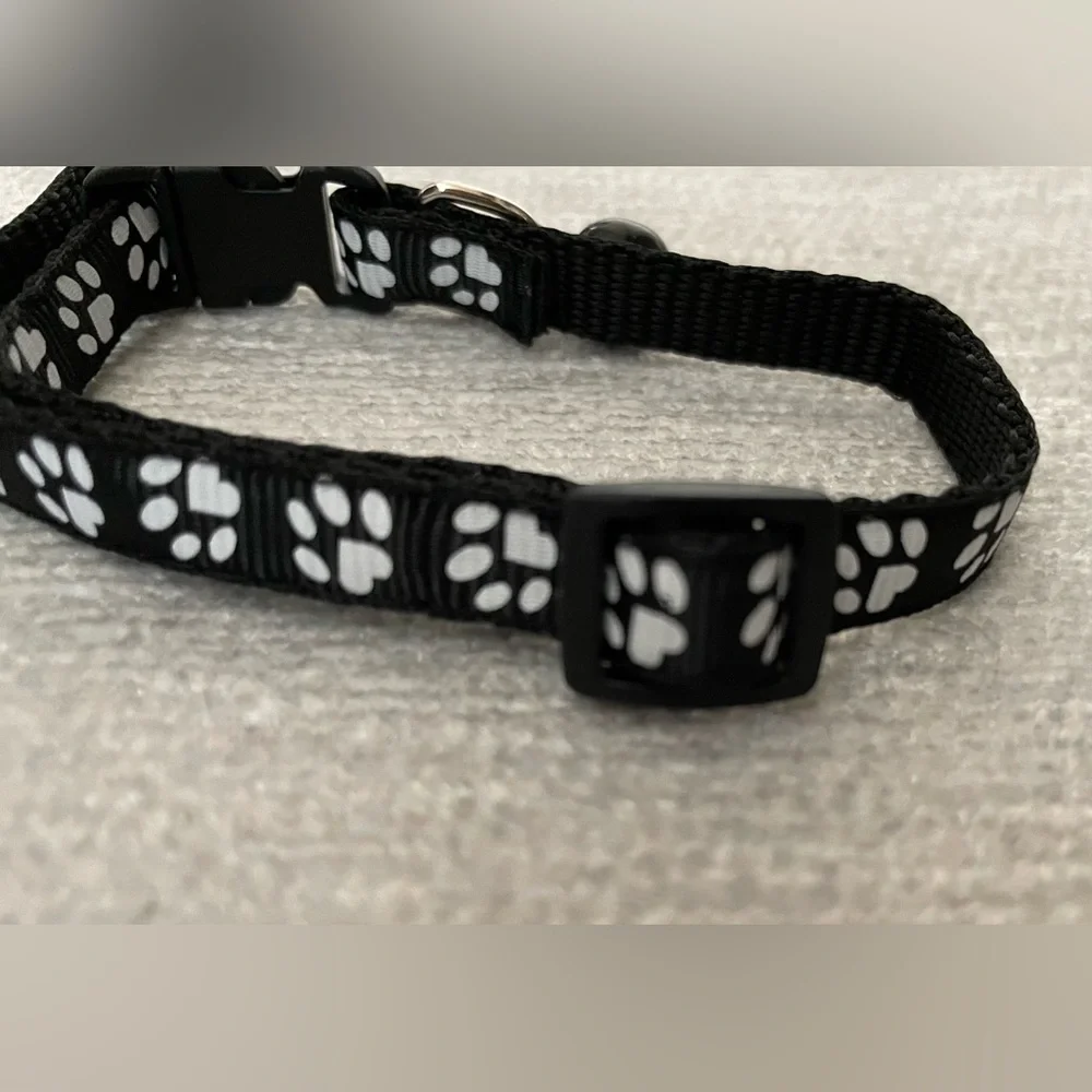 Collar with White Paw Print Pattern and Matching Bell and Buckle